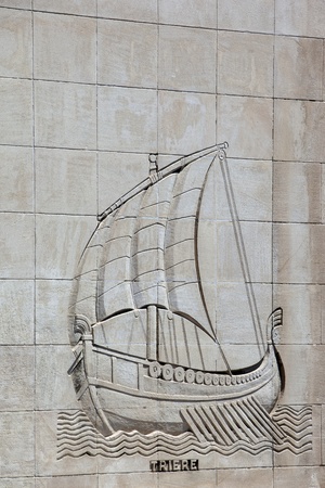 Galley carved on a stone wall of a buildingの写真素材