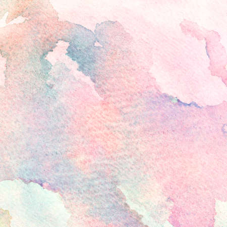 Abstract hand drawn watercolor background on textured paper in light blue and pink shades.の写真素材