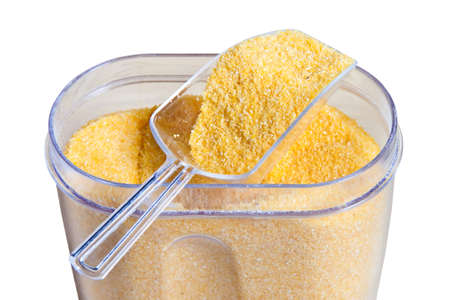 Corn grits isolated on a white background.