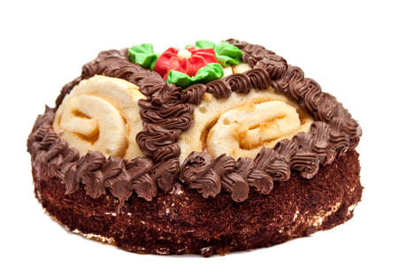 Chocolate cake with cream-colored roses. Isolated on white background. 