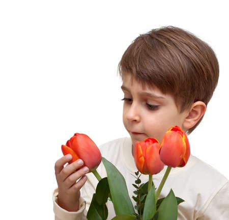 boy with a bouquet of flowers isolated on white background.の写真素材