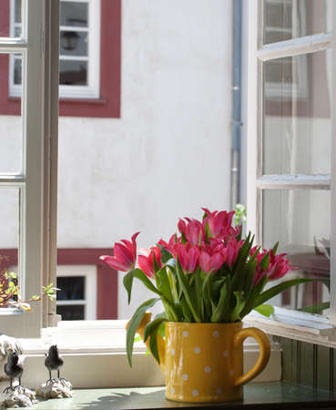 bouquet of tulips on the windowsillの写真素材