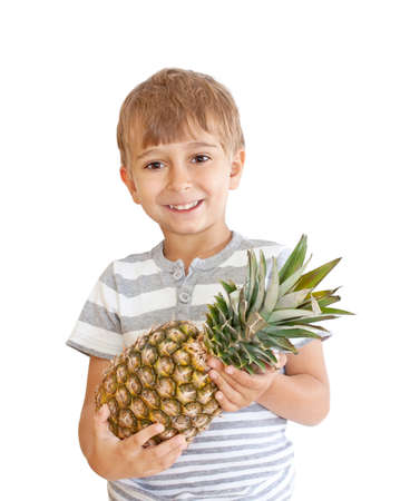boy with pineapple isolated on a white backgroundの写真素材