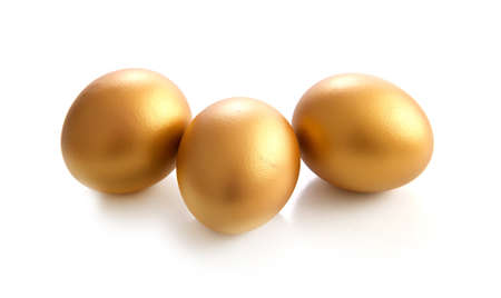 golden egg on a white backgroundの写真素材