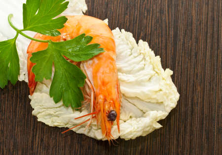 Prawn with a sprig of parsley and salad close up.の写真素材