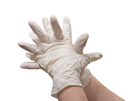 Hands of a doctor in a sterile glovesの写真素材