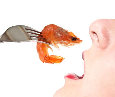 Woman eating shrimp  Isolate on white background の写真素材