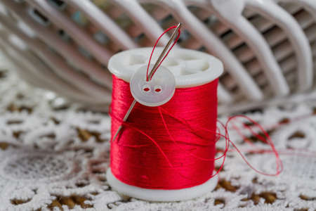 spools of thread on a wooden background の写真素材