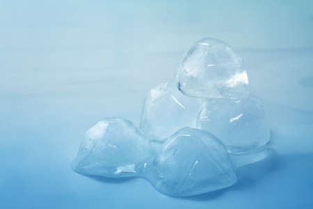 Ice cubes on blue background