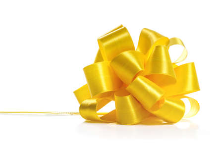 Festive yellow bow on white backgroundの写真素材