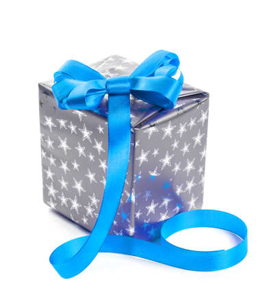 Silver gift box with a blue bow  Isolate on white backgroundの写真素材