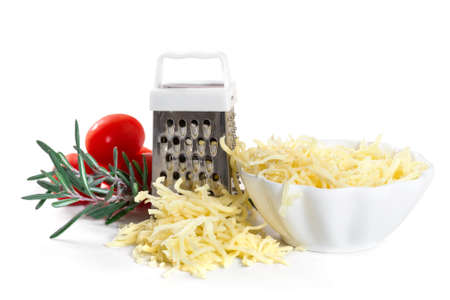 Grated cheese with grater and tomatoes on white backgroundの写真素材