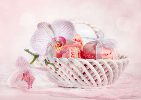 French macarons with orchid on pink background の写真素材