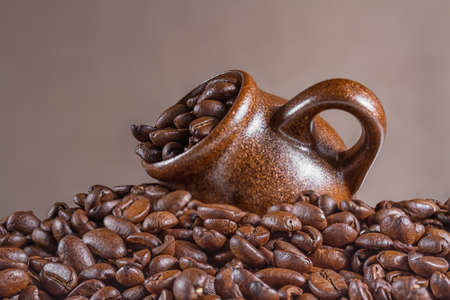 Coffee beans with cup