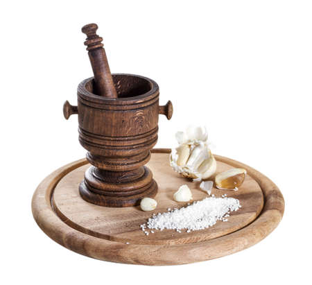 Wooden mortar with spices isolated on white backgroundの写真素材