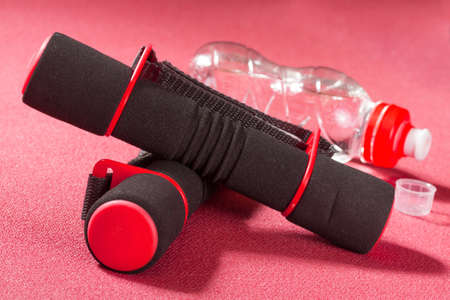 Fitness dumbbells on the sports rugの写真素材