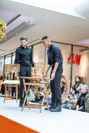 BADEN-BADEN, GERMANY - MARCH 7: Fashion model Fashion model demonstrates a new collection of garden furniture in a shopping center on March 7, 2015 in Baden-Baden. Germany. Europe.のeditorial素材