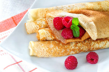 Homemade pancakes with raspberries and mintの写真素材