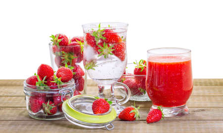 Strawberry smoothie with fresh berries isolated on white background.の写真素材