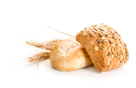 Bread loaf with pumpkin seeds and wheat. Isolate on a white background