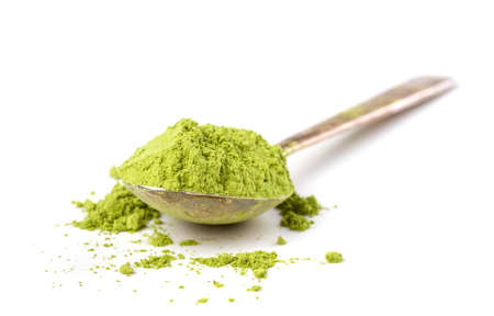 Powder green tea isolated on white background