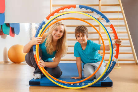 Happy, sports family, mother and son perform gymnastic exercises.の写真素材