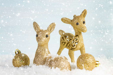 Family of deer in the snow. Christmas background.の写真素材