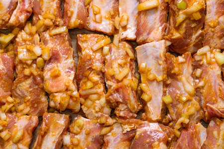Marinated pork ribs ready for roasting. Step on step recipe.の写真素材