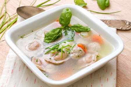 Winter warming soup with Italian tortellini from wholegrain flour with meat.の写真素材