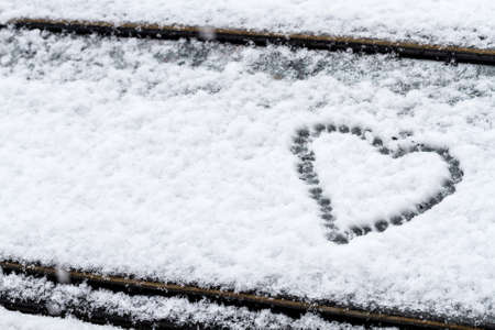 Heart symbol on a car windshield.の写真素材