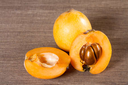 loquats on wooden backgroundの写真素材