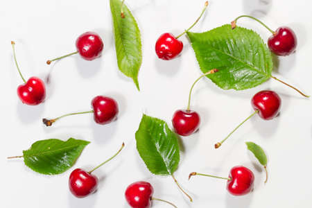 Composition of ripe cherries with leaves. Top view.の写真素材