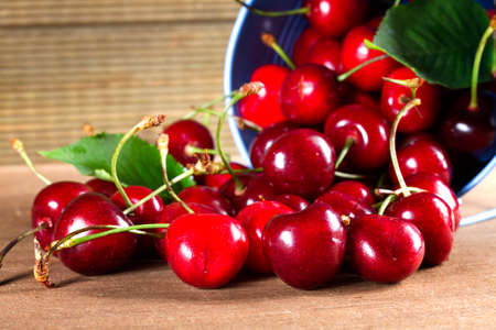 Fresh sweet cherries on the table boards