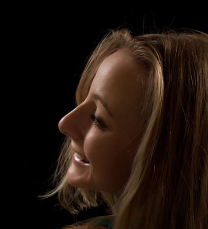Portrait of a young woman on a black background