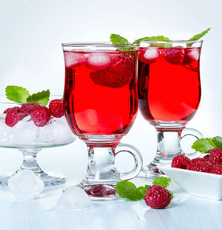 Alcohol cocktail with raspberries and mintの写真素材