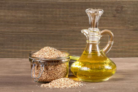 Sesame seeds and oil On a wooden backgroundの写真素材