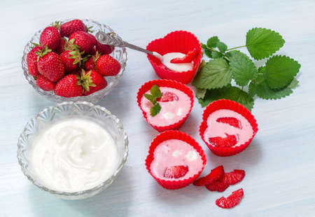 Preparation of ice cream from strawberries and yogurtの写真素材