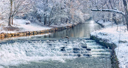 Panoramic image of a river in the snow. Germany. Baden Baden