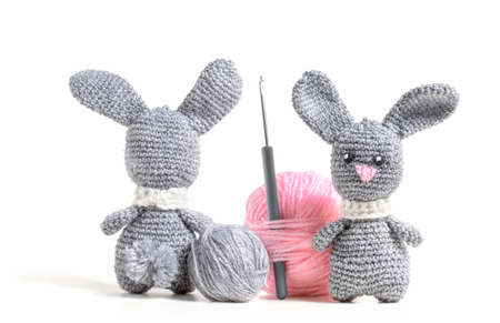 Knitted hare amigurumi with tangles of threadの写真素材