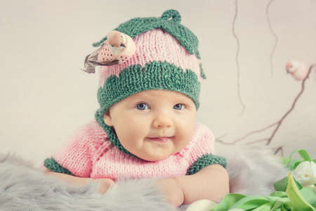 Portrait of a little girl in a pink hat. Toned imageの写真素材