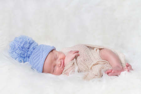 sleeping newborn baby on a blanket