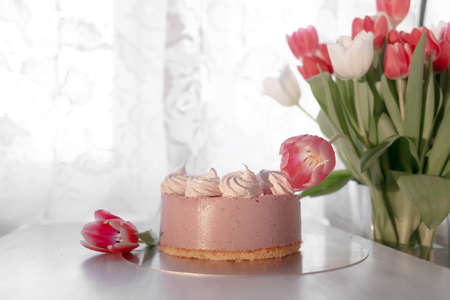Spring still life with cake and tulipsの写真素材