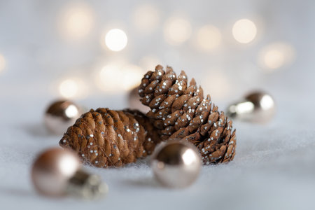 Christmas background with pine cones, snow and ballsの写真素材
