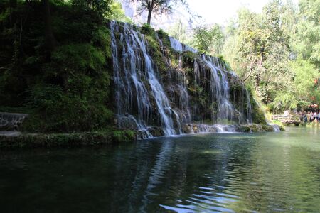 Waterfall flowing Lakeの写真素材