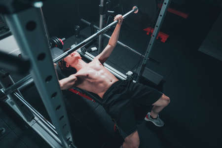 Man doing chest press in the gymの写真素材