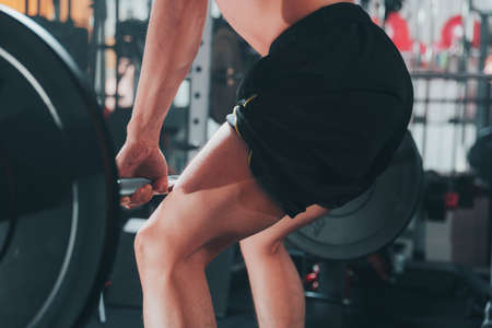 Man doing deadlift in the gymの写真素材