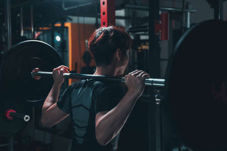 Man doing squat in the gymの写真素材