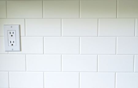 White Kitchen backsplash with a white outlet on the left sideの写真素材