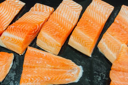 Raw salmon fillet in the supermarketの写真素材