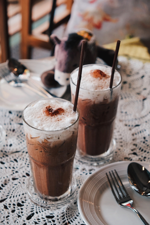 Glass of Cold Iced Mocha Coffee in the Coffee shop, Vintage toneの写真素材